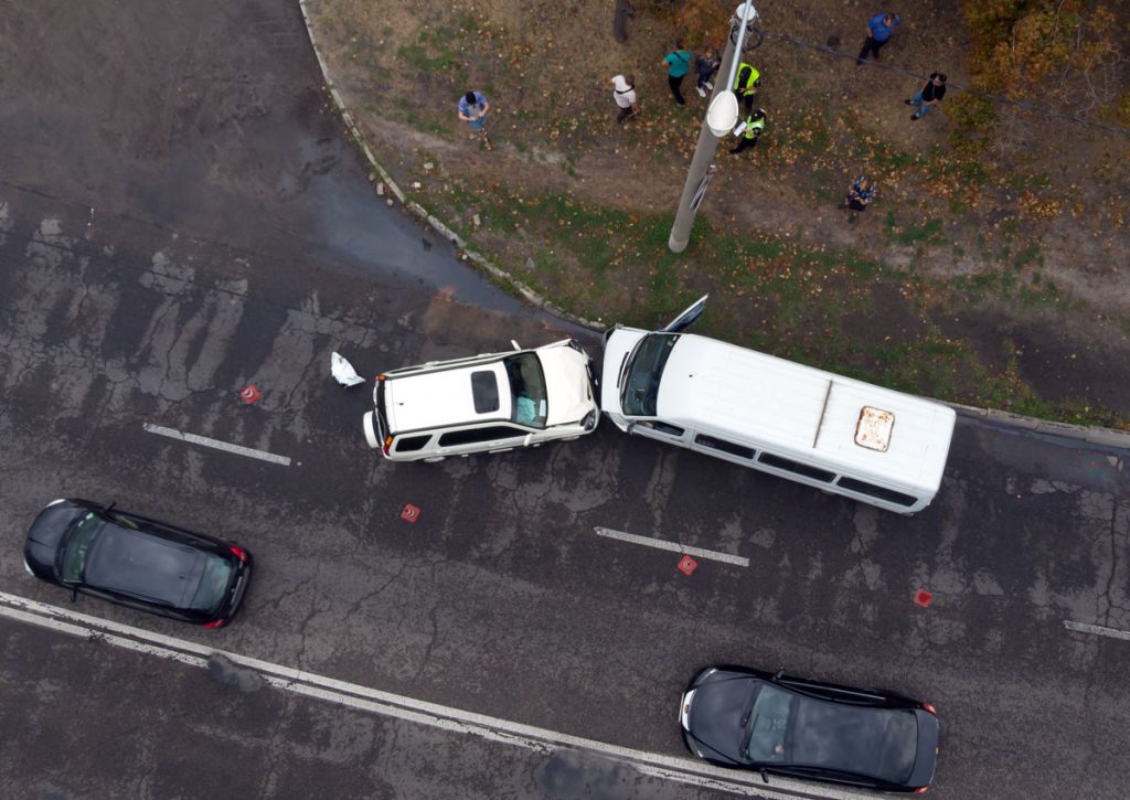 Car Accident with a Van and SUV in the Street, People on the Side of the Street