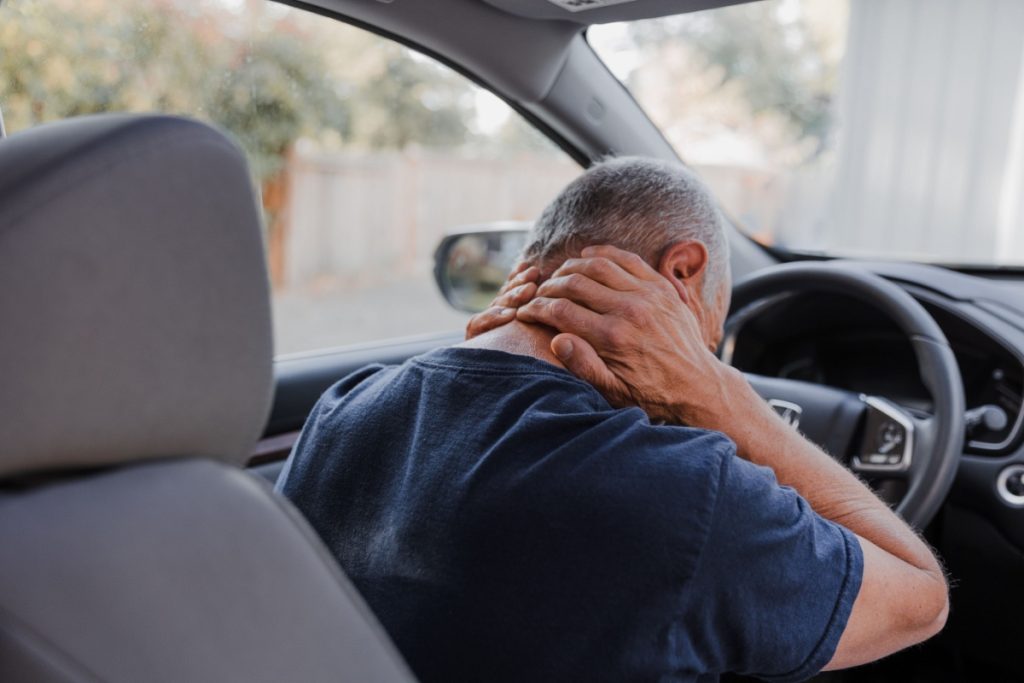 man suffering from whiplash