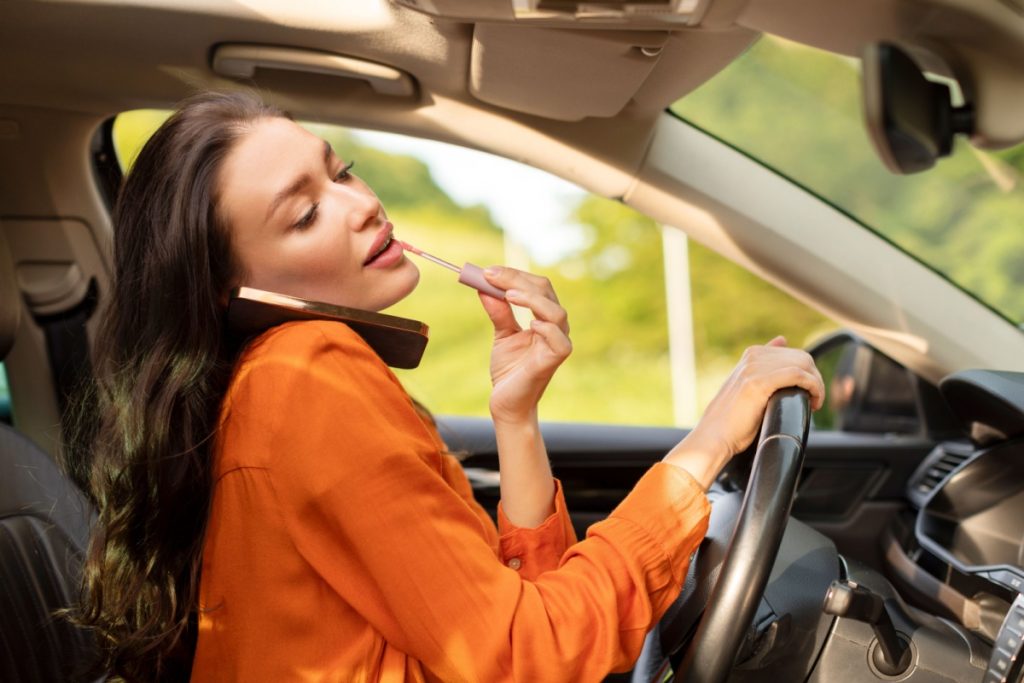 Woman Distracted while driving